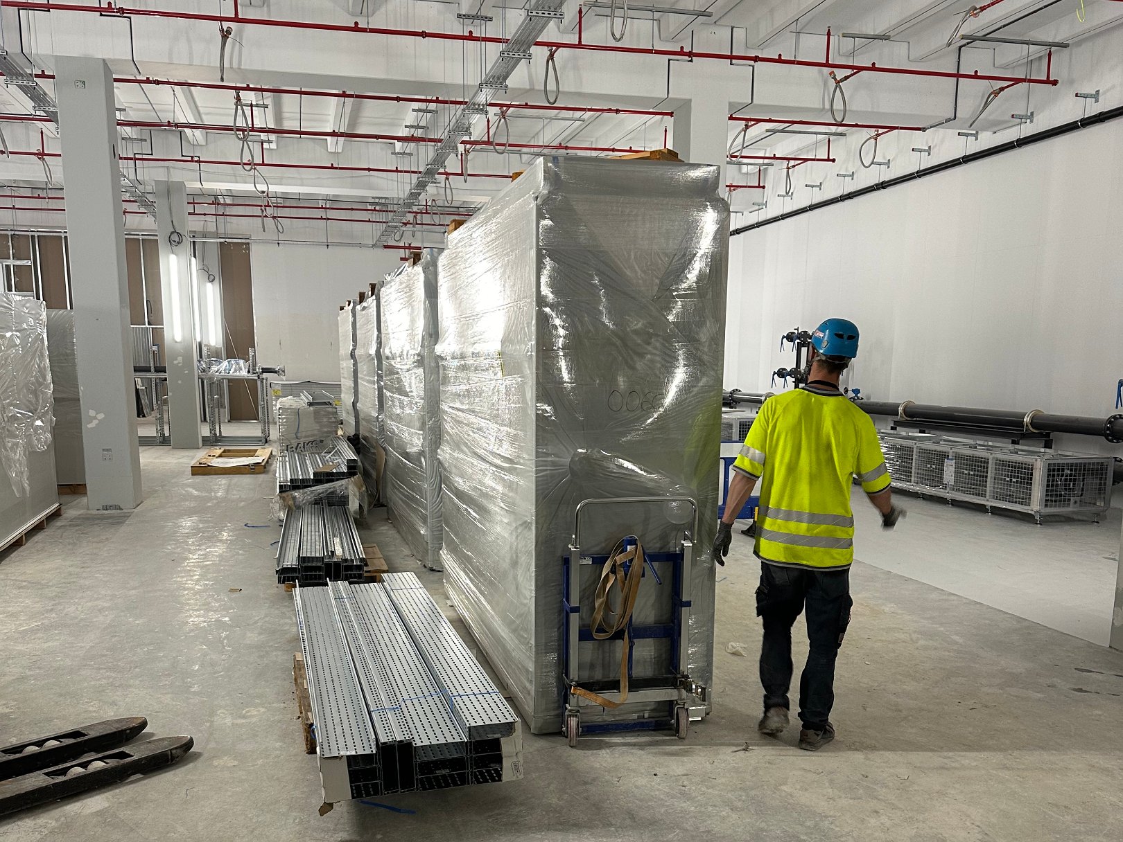 CRAH units installed in series in the white space of a data center in Raunheim