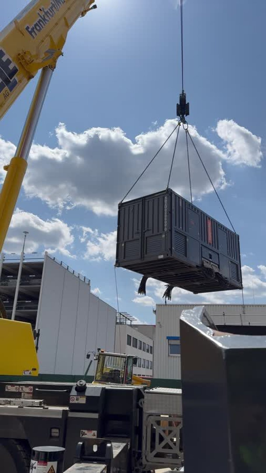 Load bank lifted by crane for generator testing at a data center in Frankfurt